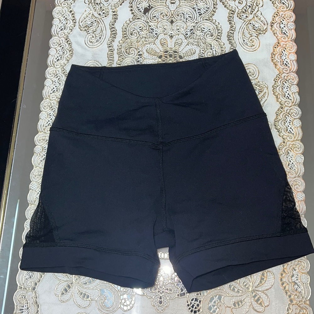 Karma black booty shorts with mesh inserts